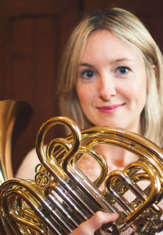 Laetitia Stott holding a French Horn