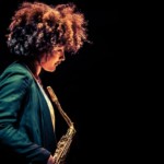 Nubya Garcia in profile holding saxophone