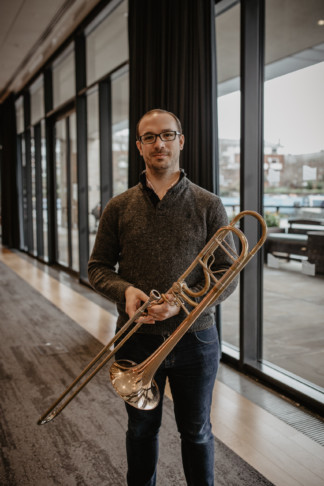 Andrew Connington holding a trombone