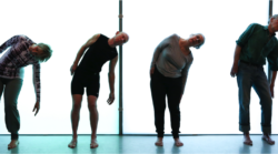 4 mature dancers performing side bend in a dance studio