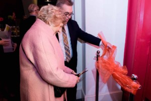 Anthony Bowne and Judi Britten cut a ribbon to open the newly named Trinity College London Room in memory of Alan Britten CBE