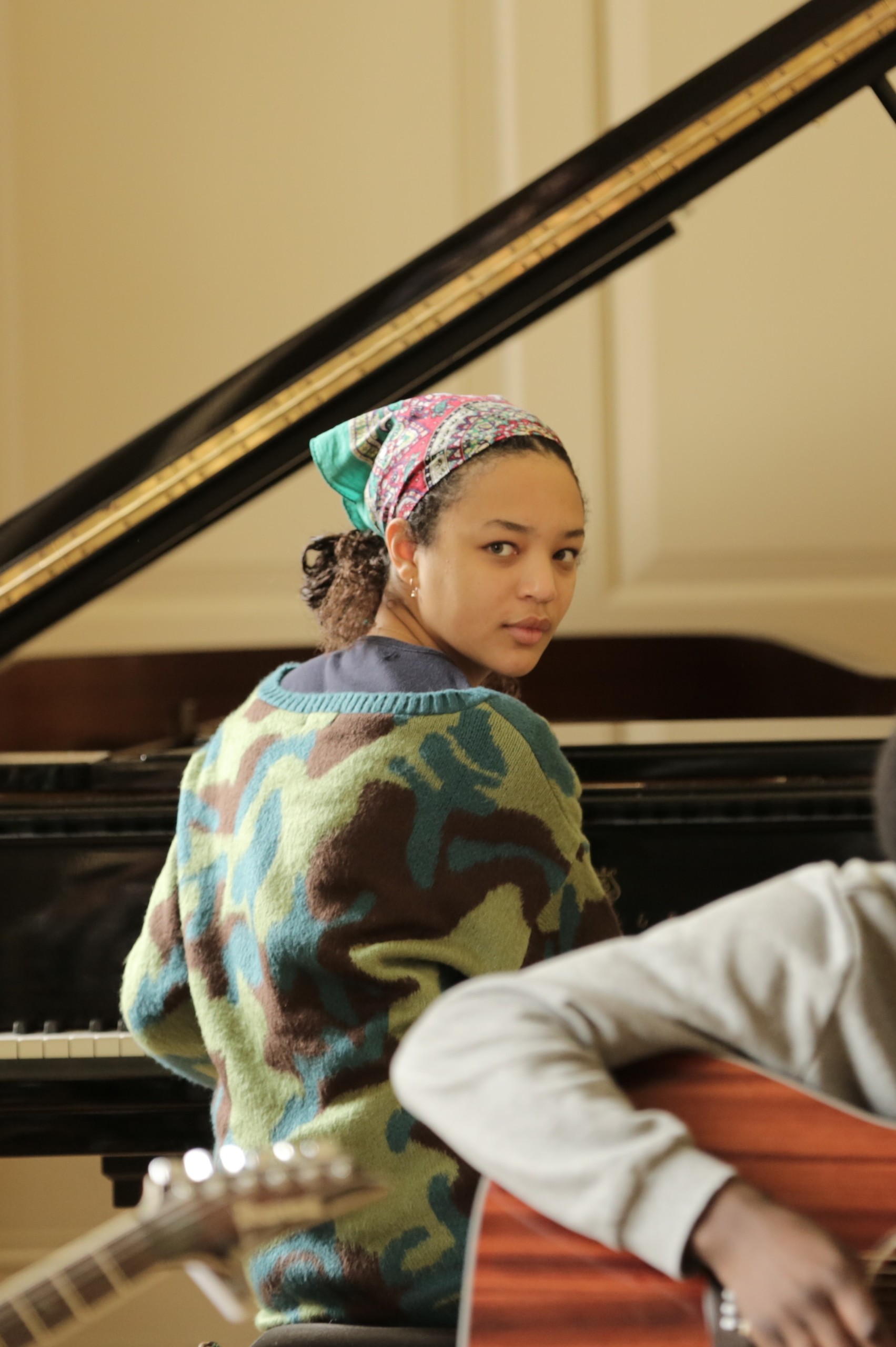 A young musician playing the piano