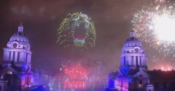 Lightshow with drones creating roaring head of lion surrounded by fireworks and up lit domes of ORNC