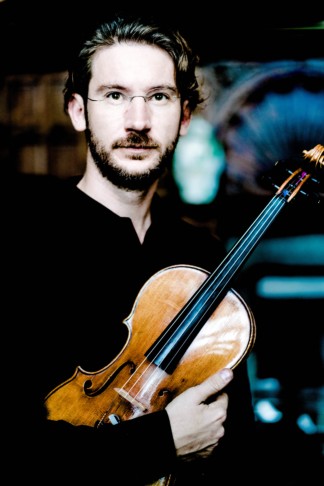 photo of Alexandru-Mihai Bota holding a viola