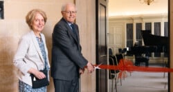 Philip Carne MBE and his wife Christine cut the ribbon to the new Philip Carne Room.