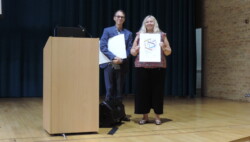 Head of Libraries, Claire Kidwell, being presented the Excellence Award for the Jerwood Library by Dr Charles Inskip