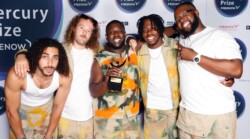Ezra Collective hold their award at the 2023 Mercury Prize