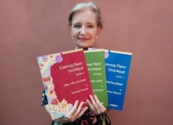 Professor Penelope Roskell photographed holding her ‘Essential Piano Technique’ series.
